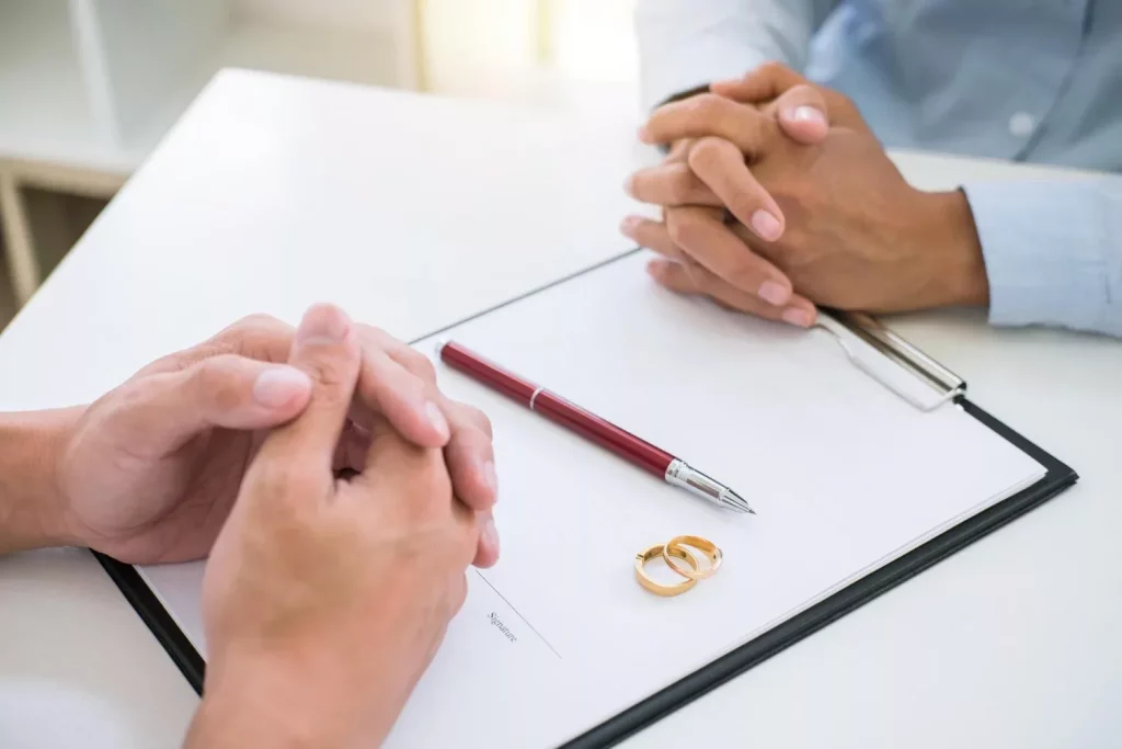 Man signing prenuptial agreement