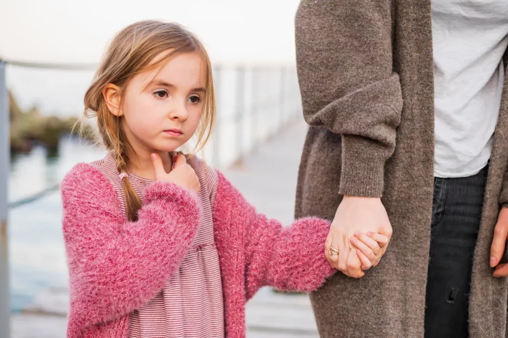 Daughter and mother holding hands