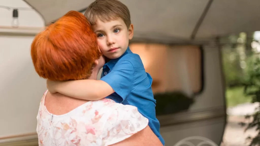 Little boy hugging his grandmother