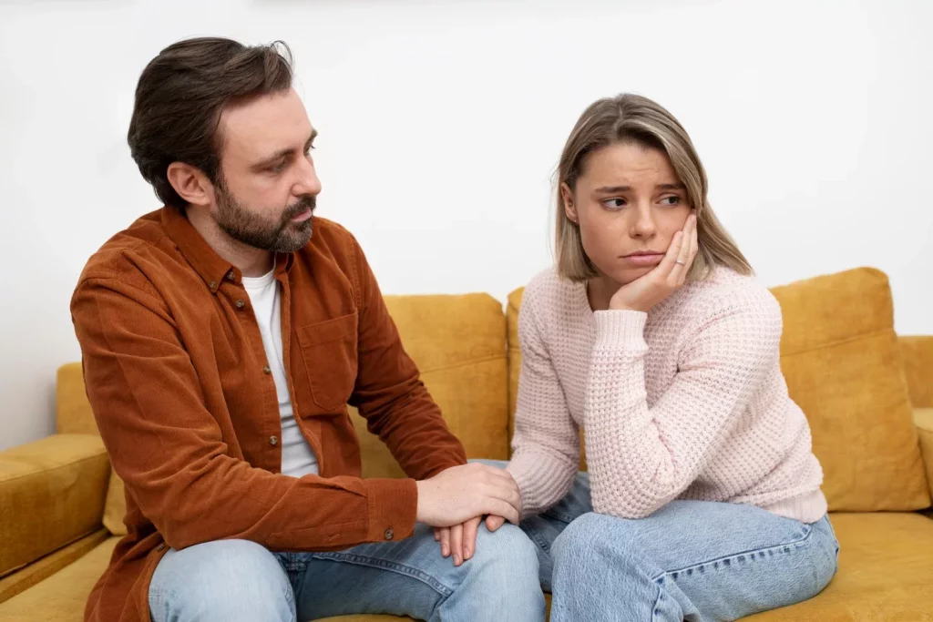 Sad couple on a couch