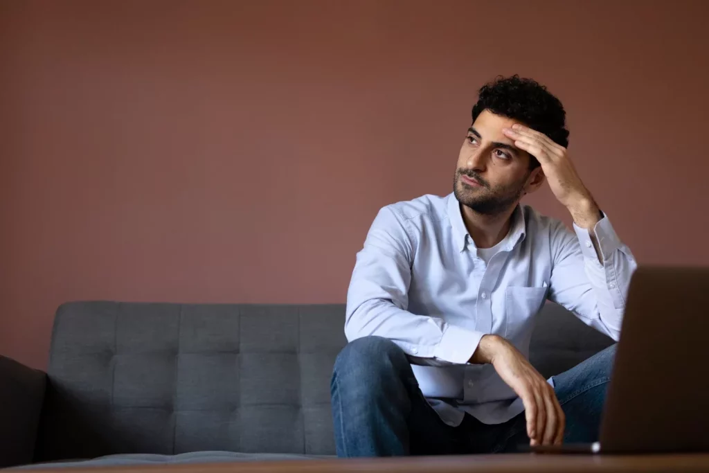 Anxious man on couch