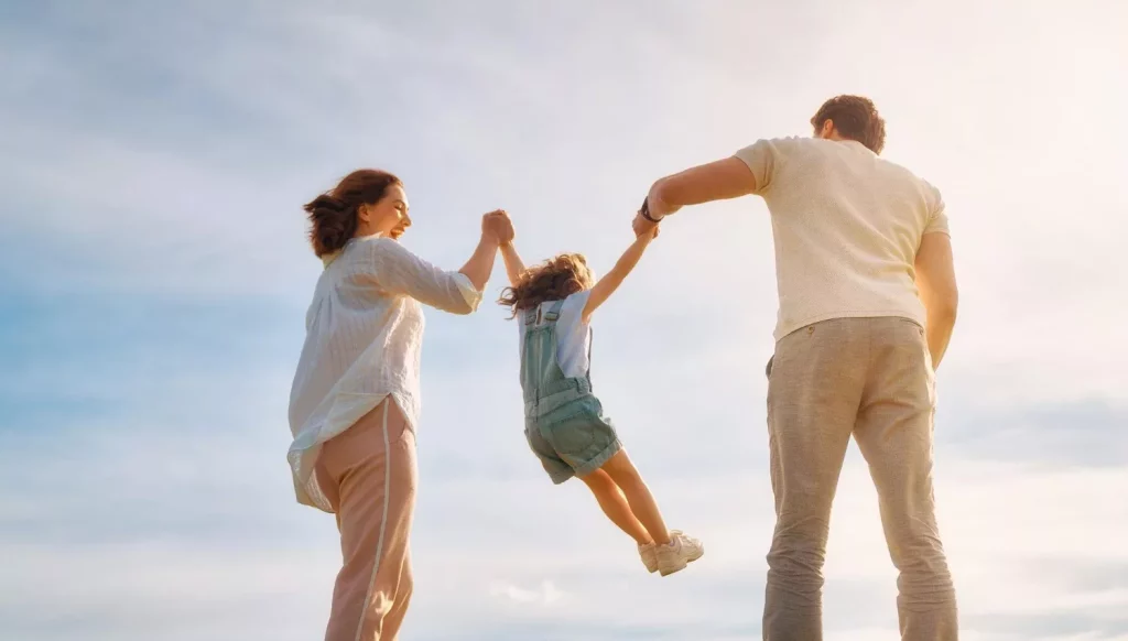 Parents playing with a child