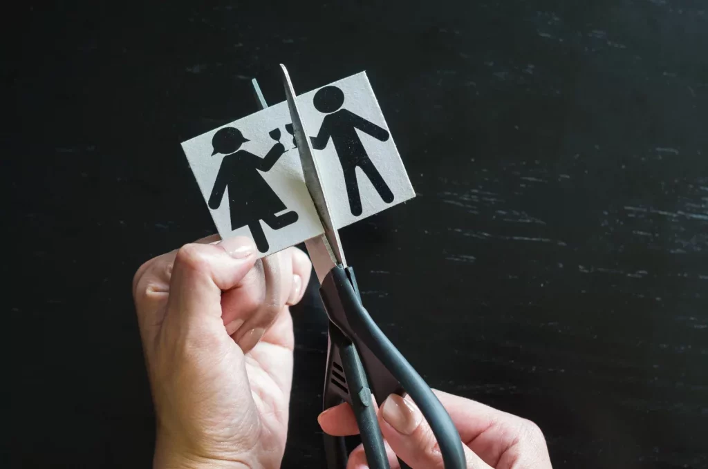 Hand cutting paper family with scissors