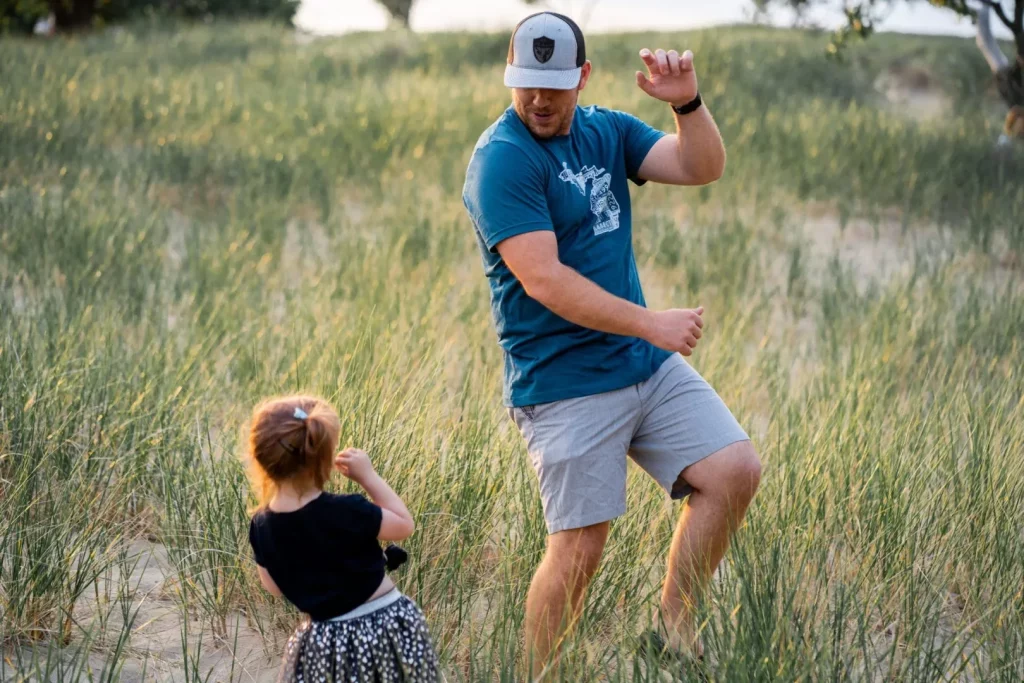 Father and daughter plaing outside