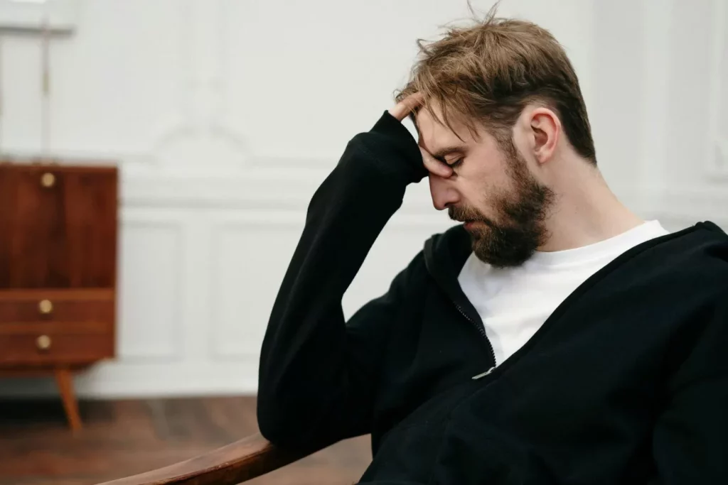 Upset man sitting on chair