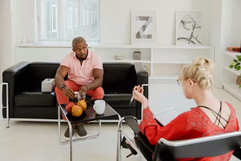 A man listening to a counselor